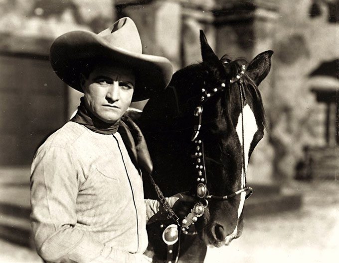 Tom Mix was an American film actor who starred in early Western movies between 1909 and 1935. The ten gallon hat was Tom Mix's trademark. Mix would even help an unemployed John Wayne find work shifting props at Fox Studios, helping Wayne launch his Hollywood career. (Photo: Flickr/Breve Storia del Cinema)