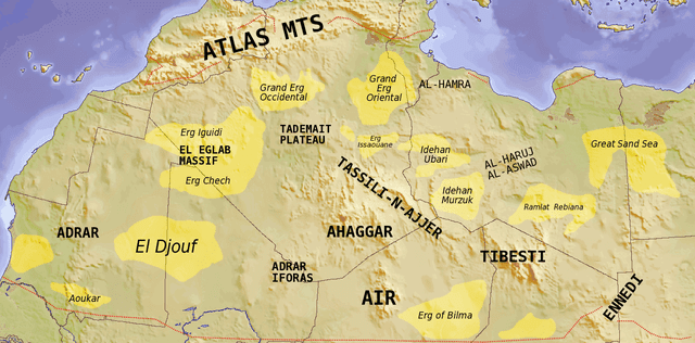 Map showing major Dune seas (ergs) and Mountain ranges of the Sahara. Red dashed line shows approximate limit of the Sahara. National borders in grey. Dune seas in yellow. (Image: Wikipedia/TL Miles)