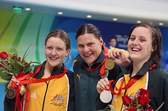 It wasn't until 2008 that another competitor with a prosthetic leg would compete in the Olympics again. Natalie Du Toit (centre) was one of two Paralympians to compete at the 2008 Summer Olympics in Beijing; the other being table tennis player Natalia Partyka. (Photo: Wikimdia/Heath Campanaro/)
