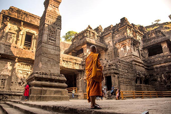 Aurangabad, Maharashtra, India, 27 November 2019 : Buddhist monk visit to the Kailasa Temple, Ellora caves, It is one of the largest rock-cut cave in the world and UNESCO world heritage site. (Photo: Shutterstock)