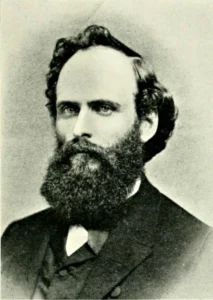 A black and white photo capturing a bearded man.