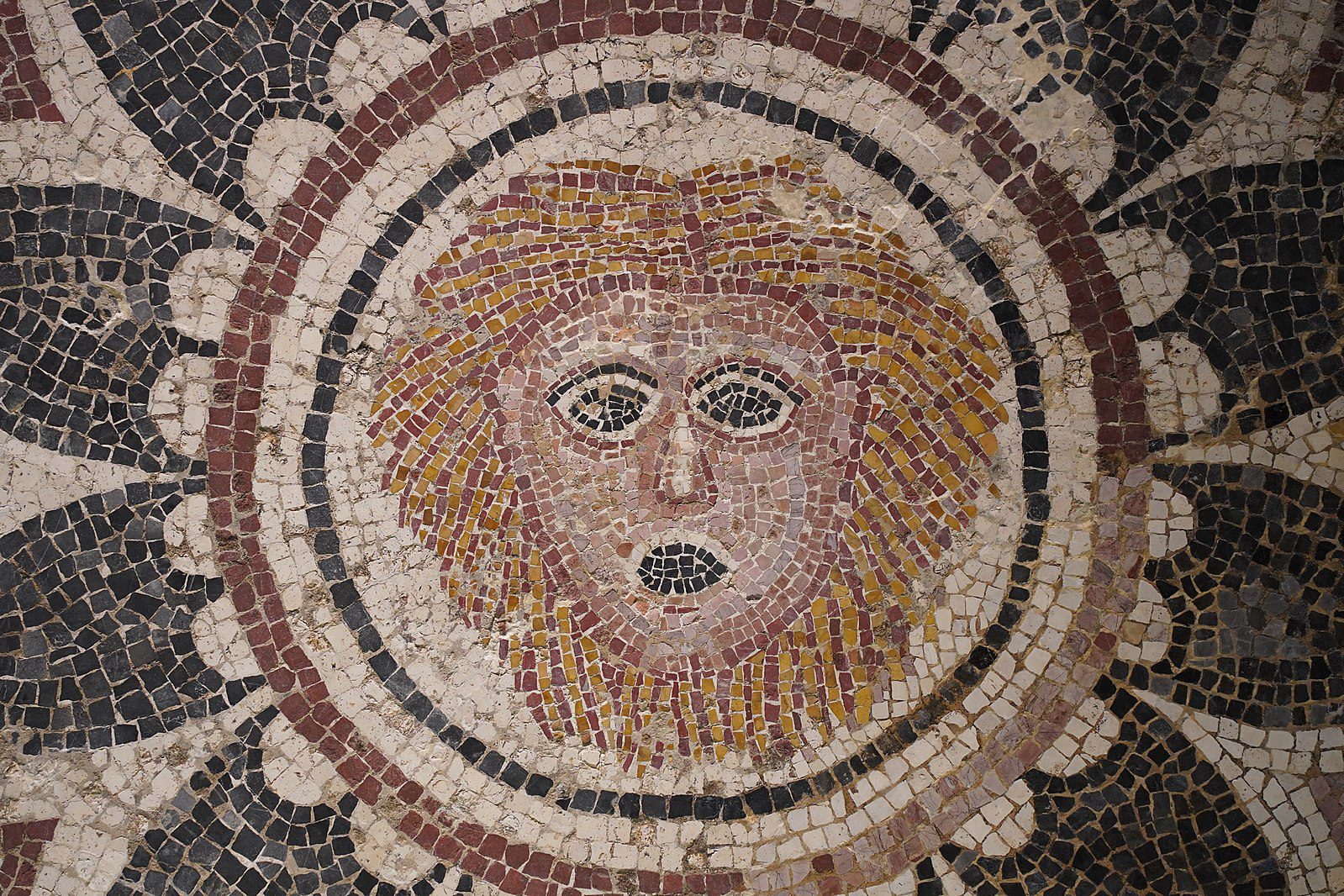 An ancient mosaic piece depicting Phobos, the god of fear and panic, dating back to 300-400 AD. Once nestled at the terminus of a corridor within a Roman villa in Bodrum (Halicarnassus).