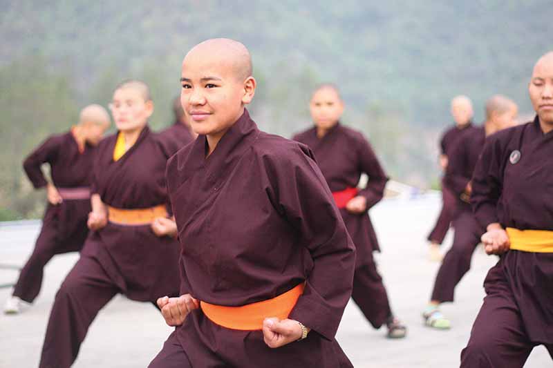 The fighting Kung Fu nuns of the Drupka Order. The Kung Fu nuns teach self-defense and help the needy throughout the Himalayas. (Photo: Wkimedia/Drukpa Publications Pvt. Ltd)