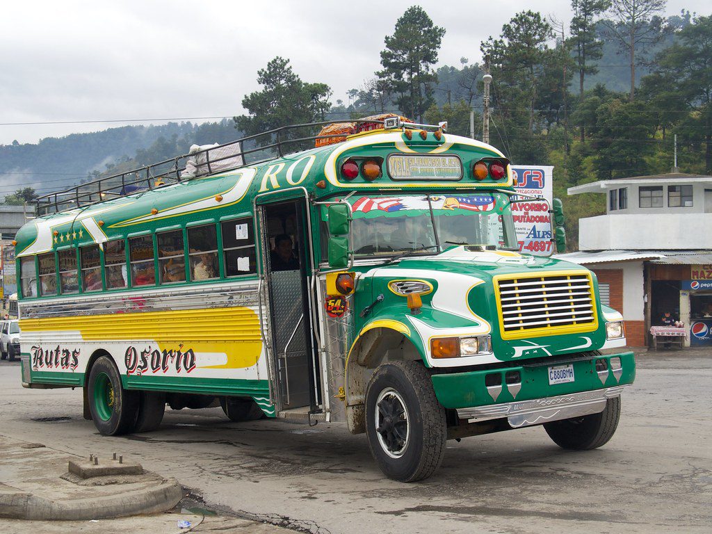 A Chicken Bus at Quatro Caminos in Guatemala (Source: Flickr/Laurent de Walick)