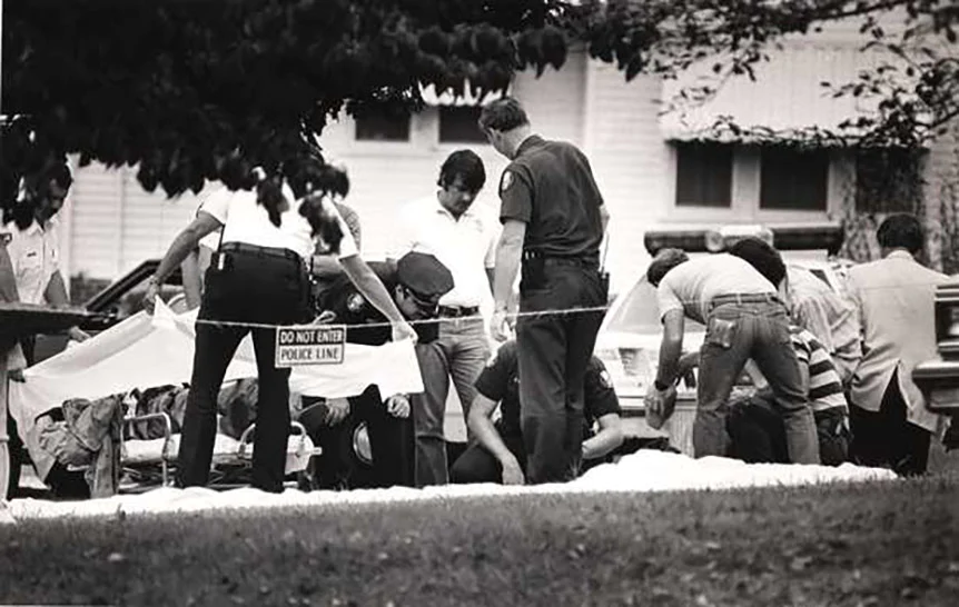 Police investigate the death of Andrew Thornton, in a Knoxville man's front yard, on Sept. 11, 1985.