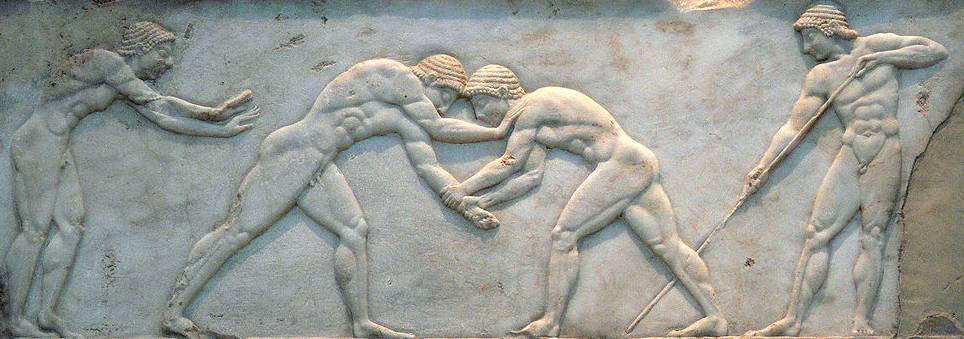 Base of a funerary kouros found in Athens, built into the Themistokleian wall. Three sides are decorated in relief: wrestlers are on the front side, an unspecified athletic game (known as "Ball Players") on the left side, a cat and dog fight scene on the right side. (Photo: Wikimedia/National Archaeological Museum of Athens)