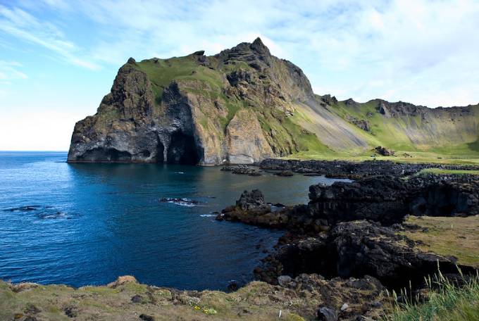 The beautiful island of Heimay off the coast of Iceland is home to the spectacular Elephant Rock which can be seen in the distance. (Photo: Flickr/Thomas Quine)