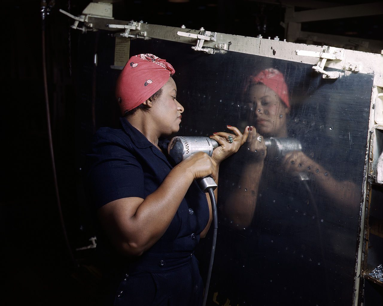 A real-life "Black Rosie" riveting an A-31 Vengeance dive bomber in Tennessee (February 1943) (Credit: Wikimedia) 