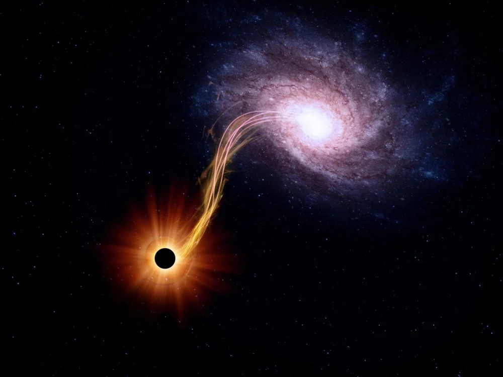 An artist's rendition of a black hole feeding off a spiral galaxy. (Credit: Pixabay)