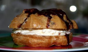 Typical Icelandic bun, with cream, jam and chocolate on top.