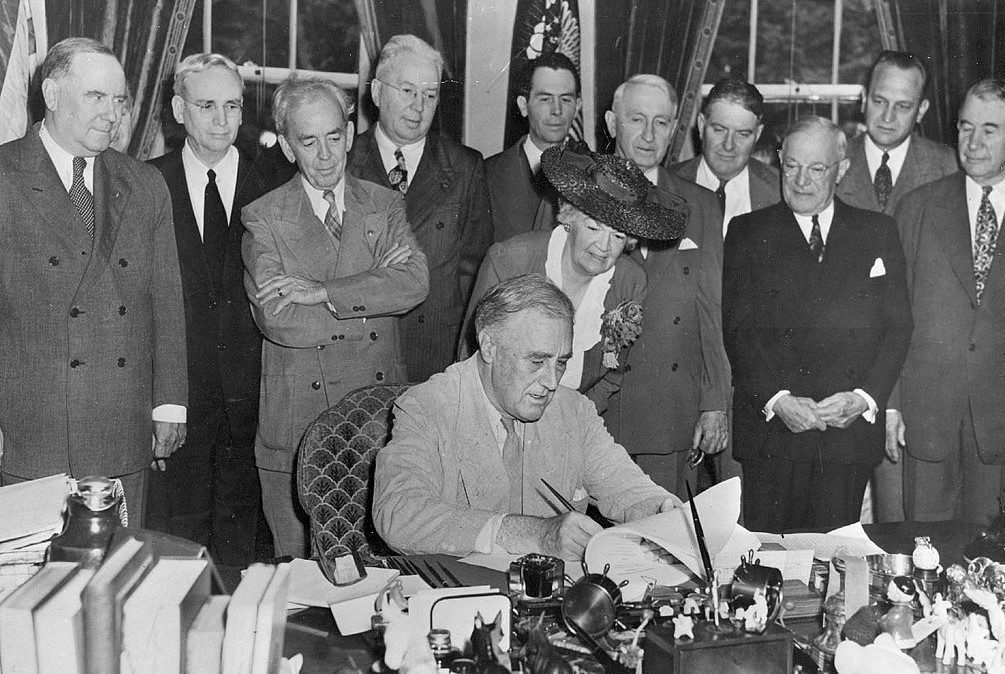 President Franklin D. Roosevelt signing the GI Bill of Rights in the Oval Office, June 22, 1944