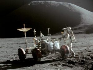 Photograph showing astronaut Jim Irwin and the Apollo 15 lunar rover