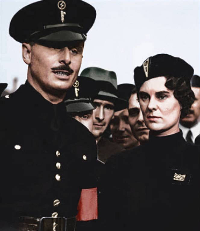 Oswald Mosley and his wife, Diana Mitford, march with his Black Shirts to the East End of London.